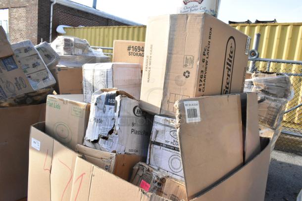 Boxes containing scratch and dent items including take out containers, hot cups, and speed rail, some boxes damaged.