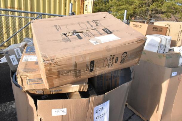 Boxes of brand new scratch and dent items, including paper hot cups labeled "32 oz, 500/case," visible markings on packaging.