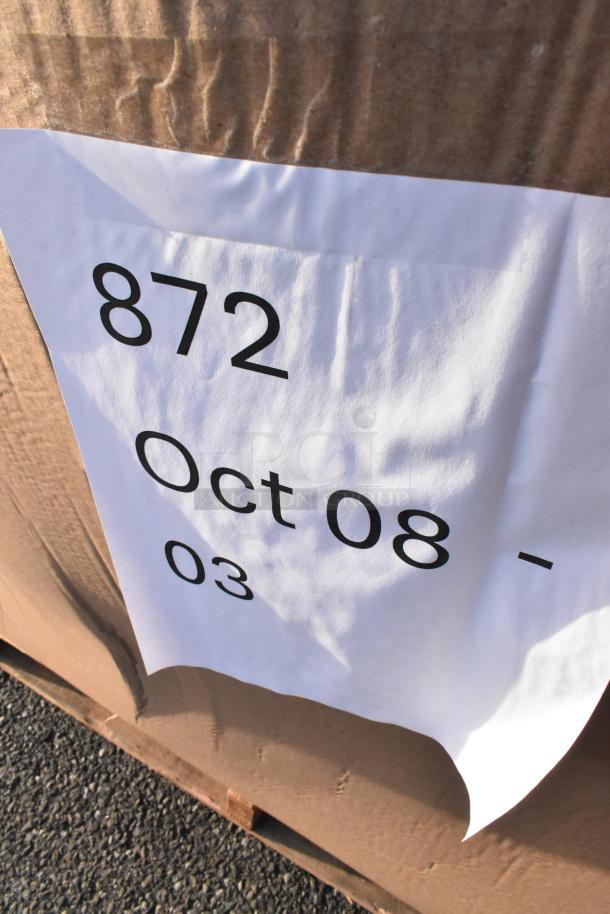 Cardboard box labeled "872 Oct 08 - 03" containing 24 new scratch and dent items like trash cans and paper goods.