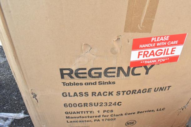 Cardboard box for Regency glass rack storage unit, model 600GRSU2324C, marked "Fragile." Visible scratches and dents.