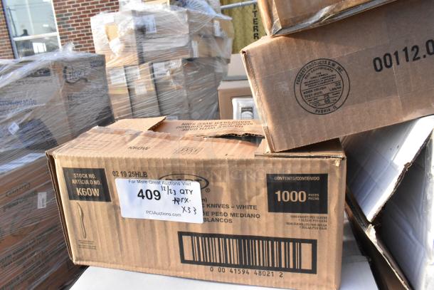 Cardboard box with label "1000 pieces" and "409 1/2 1/3 QTY," containing new scratch and dent items like tasting forks and foil bags.