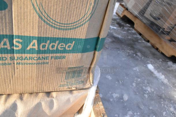 Cardboard box labeled "No PFAS Added" containing scratch and dent items, made of sugarcane fiber, compostable, microwaveable.