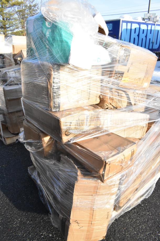 Shrink-wrapped stack of new cardboard boxes labeled "Safety First" and "Infinite" on a pallet outdoors.