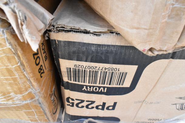 Damaged boxes labeled "28 OZ BLACK" and "IVORY" with visible barcode, part of a lot of 24 scratch and dent items.