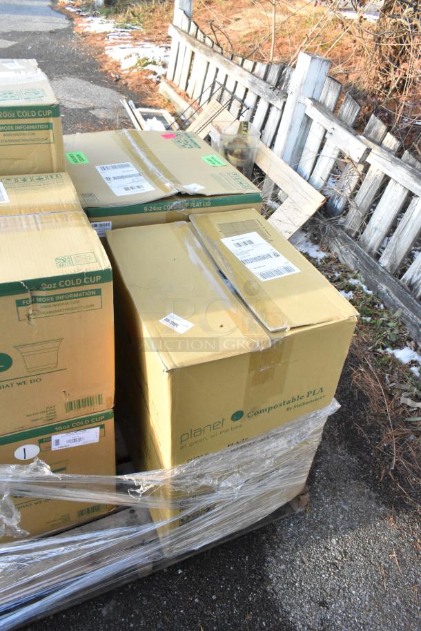 Boxes of new scratch and dent cold cups and lids, branded with Planet Compostable PLA, wrapped on a pallet.