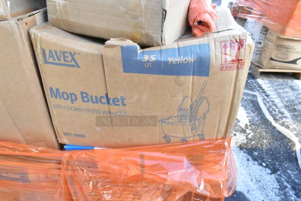 Cardboard box labeled "Avex Mop Bucket with Down Press Wringer," 35 qt capacity, yellow, showing a fragile sticker.