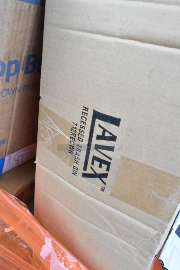 Cardboard box labeled "Lavex Recessed Trash Bin 712RECWR." Contains various scratch and dent items. Brand new condition.