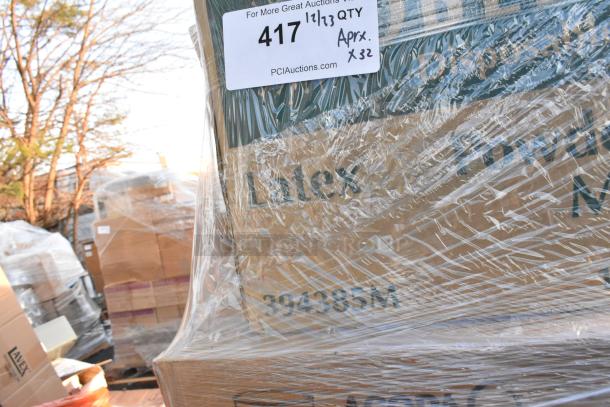 Shrink-wrapped pallet of 32 new scratch and dent items, including chicken buckets and gloves. Label reads "For More Great Auctions," QTY x32.