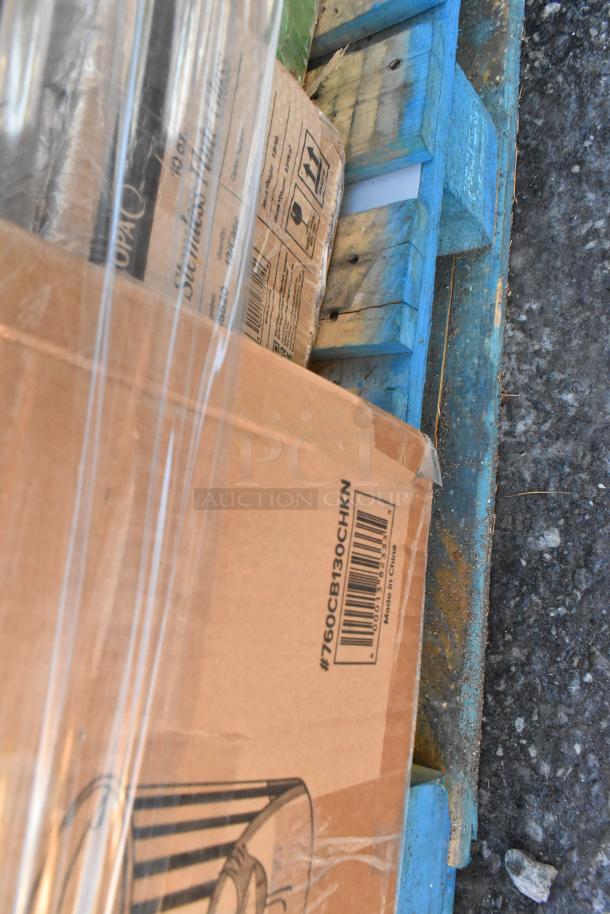 Box of assorted scratch and dent items including chicken buckets, gloves, and glasses. Visible barcode: #760CB130CHKN.