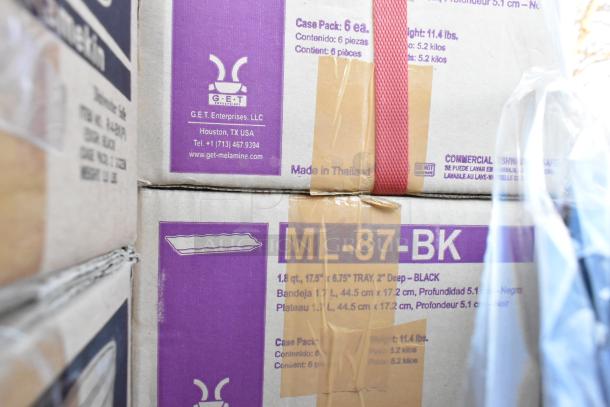 Boxes containing G.E.T. Enterprises ML-87-BK trays, 1.8 qt, 17.5"x6.75", black. Marked dishwasher safe. Made in Thailand.