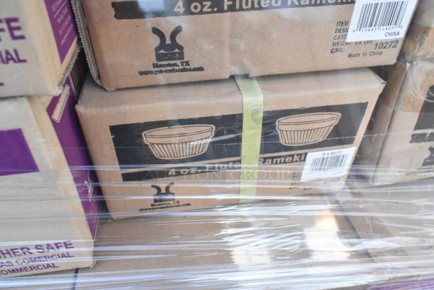Boxes of 4 oz. fluted ramekins sealed in plastic wrap. Visible labels show Houston, TX and Made in China. Brand new condition.