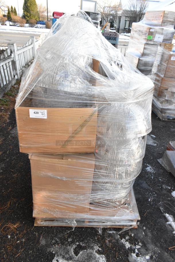 Plastic-wrapped pallet with 16 new scratch and dent items including clear punch bowls in boxes. Visible label "420 Utility Apt."