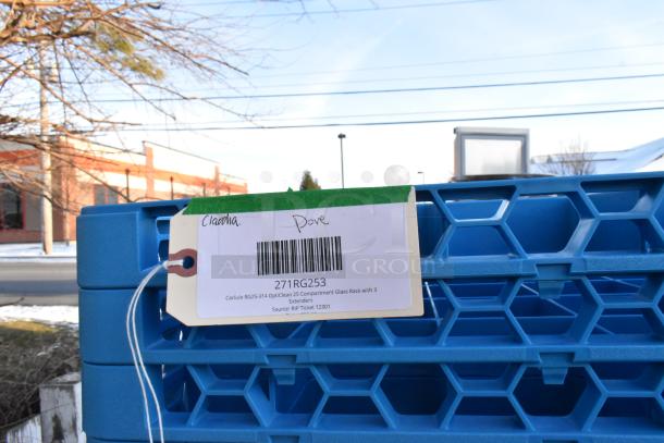 Blue Carlisle RG25-314 OptiClean glass rack with tag, 25 compartments, includes 3 extenders, shown outdoors.