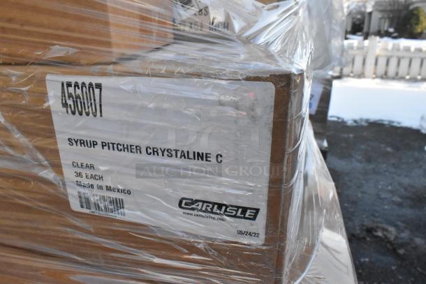 Stack of boxes labeled "Syrup Pitcher Crystaline C," 36 each, clear, by Carlisle. Plastic wrapped, label shows made in Mexico.