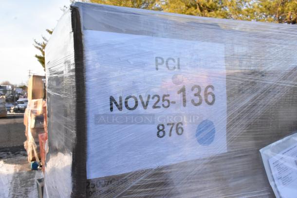 Pallet with new scratch and dent items, wrapped in plastic. Label reads "PCI NOV25-136 876." Contains container lids, paper towels, cups, and bags.