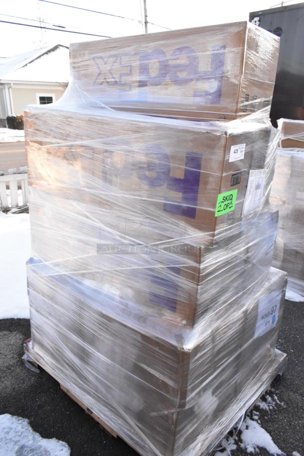 Pallet of 7 scratch and dent items wrapped in plastic, including stools and table bases; FedEx box visible; labeled "Skid 2 of 2."