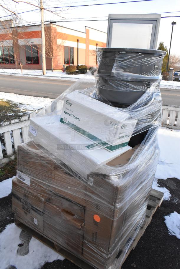 Wrapped pallet with 14 new scratch and dent items, including a trash can and Regency drawer, visible boxes of guest towels.