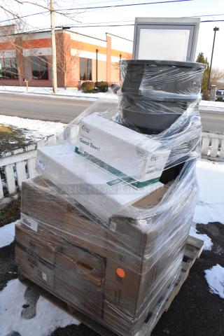 Wrapped pallet with 14 new scratch and dent items, including a trash can and Regency drawer, visible boxes of guest towels.