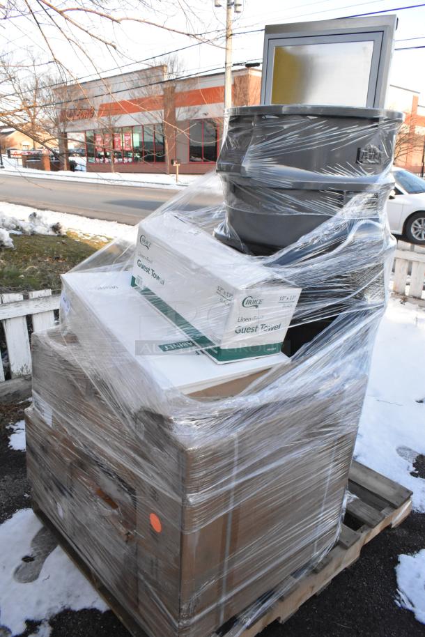 Shrink-wrapped pallet with 14 brand new scratch and dent items, including trash cans and boxed Regency drawer, on a wooden base.