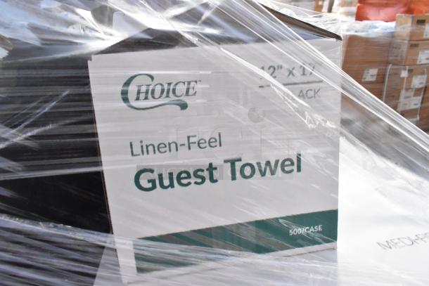 Plastic-wrapped box labeled "Choice Linen-Feel Guest Towel, 500/case" amid auction items including trash can, Regency drawer.