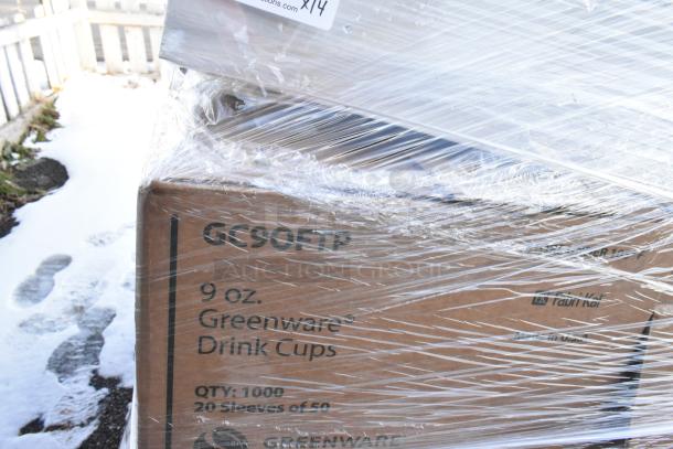 Pallet wrapped with boxes labeled "9 oz. Greenware Drink Cups, QTY: 1000." Snow visible in background.