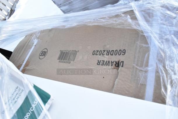 Cardboard box labeled "Drawer 600DR2020" under plastic wrap, indicating brand new scratch and dent items, part of a 14-item lot.