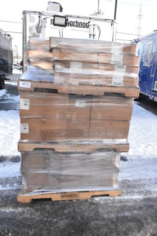 Stacked pallets of 52 brand new scratch and dent items, wrapped in plastic. Includes towel adapters. Labels show item codes.