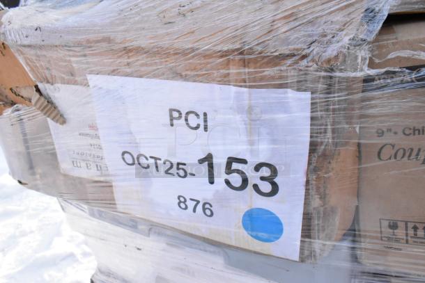 Plastic-wrapped stack of new kitchen items with label "PCI OCT25-153 876." Includes tray rack, colander, plates, and ice bin.
