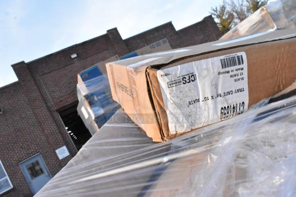 Box with visible label indicating "TRAY CASE 14 X 10," marked "LOFS BRANDS," seen on plastic-wrapped pallets, industrial setting.