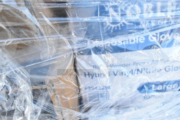 36 new scratch and dent items, including containers, napkins, trays, and gloves, wrapped in plastic. Visible glove packaging.