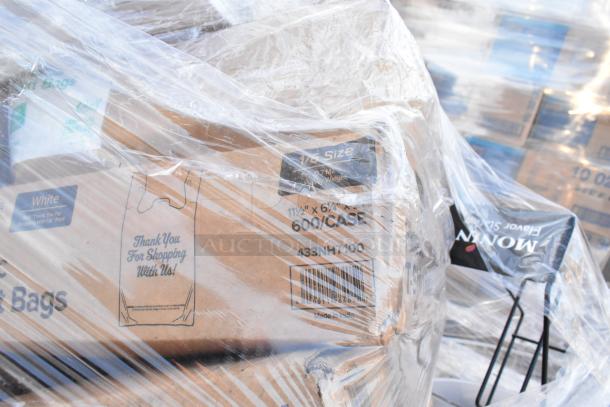 Plastic-wrapped pallet of mixed items including containers, napkins, fast food trays, and gloves. Box labeled "600/Case," "Made in India."