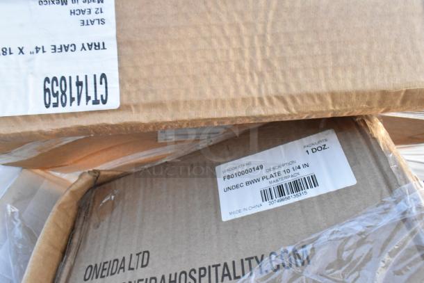 Cardboard boxes containing various hospitality items such as plates. Labels show item descriptions and unit details.