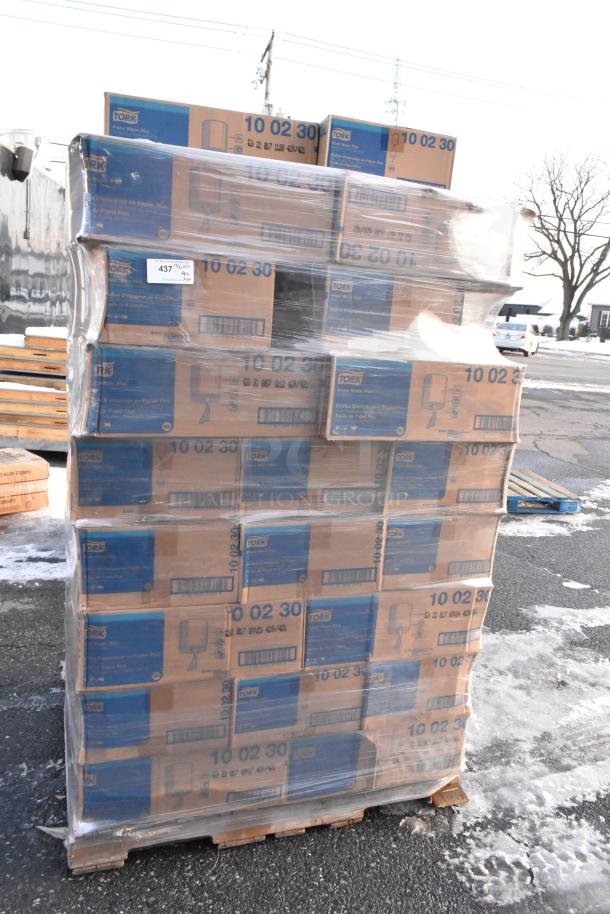 Pallet of 34 Tork 10 02 30 Centerfeed Paper Wiper boxes, wrapped in plastic. Boxes are marked: 1-Ply, 7.7 x 11.8 inches.