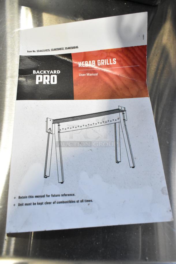 Backyard Pro 554KEBAB46 stainless steel charcoal kebab grill, scratch and dent, with user manual.