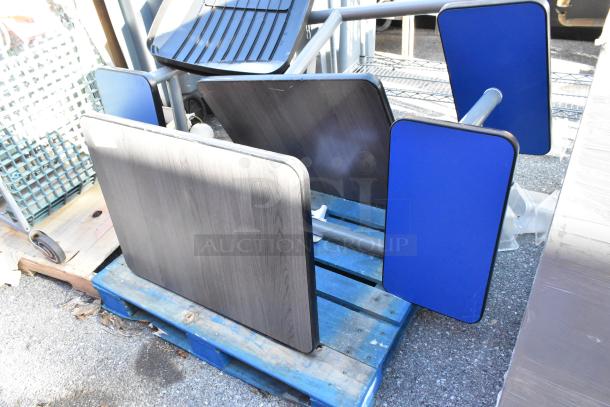 2 booth setups with blue tabletops and benches, resting on blue pallets. Some wear visible.