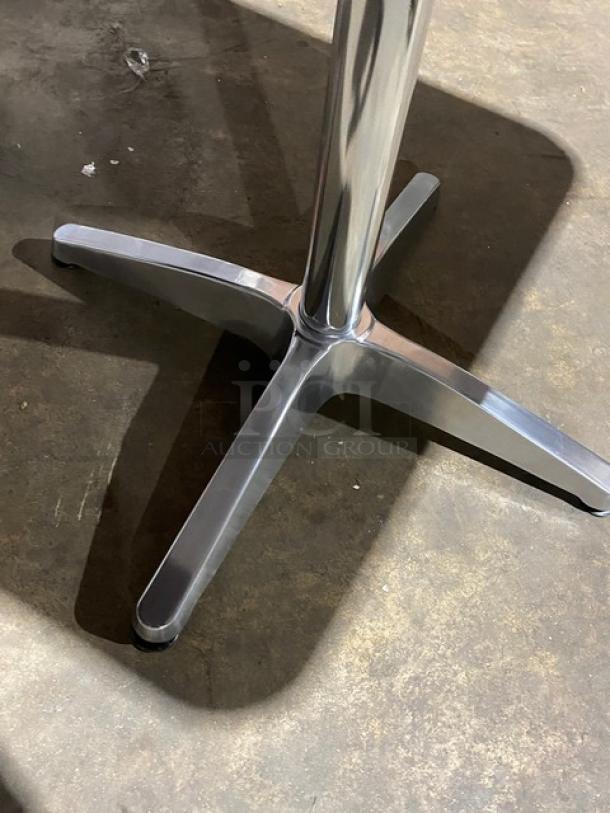 Brand new aluminum square dining table, Model ST413, with pedestal base, suitable for indoor/outdoor use.