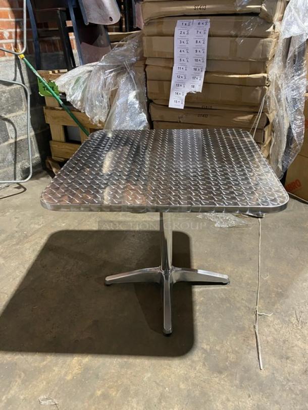 Brand new aluminum square dining table, model ST413, with pedestal base; lightweight for indoor/outdoor use.
