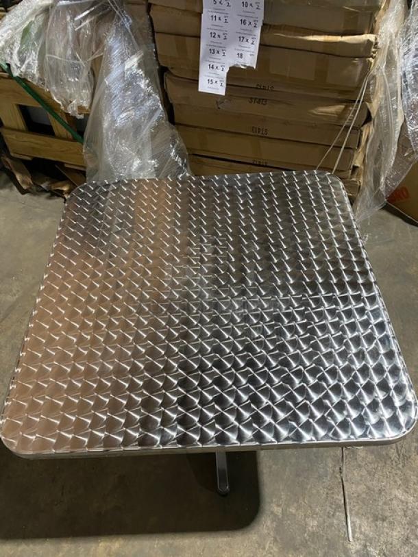 Brand new aluminum square dining table, model ST413, with pedestal base. Lightweight, suitable for indoor/outdoor use.