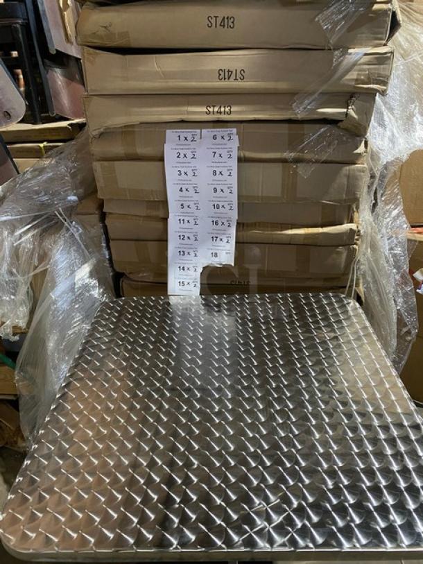 Brand new aluminum square dining table, model ST413, with a pedestal base; features a shiny, textured surface.