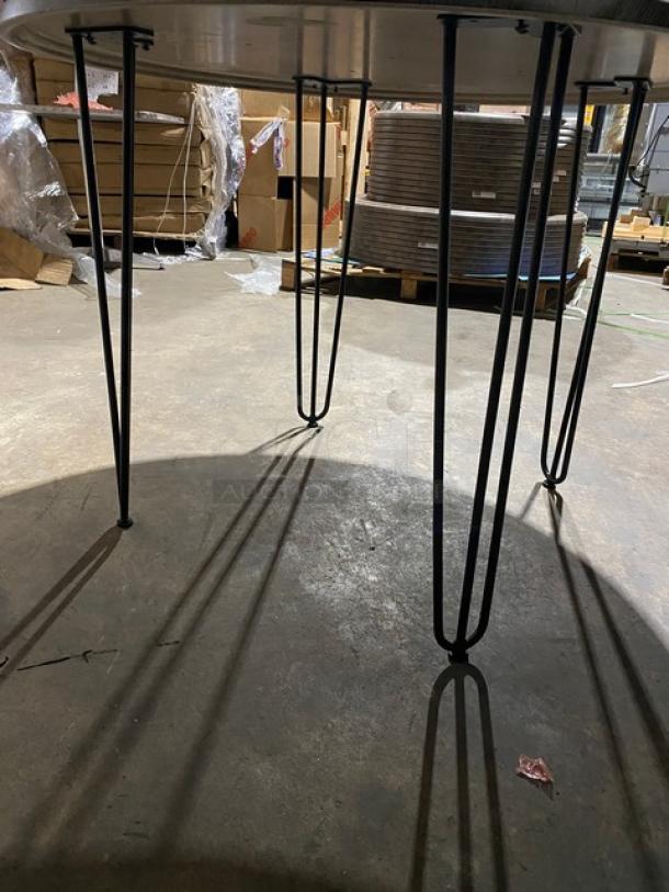 Werzalit Ponderosa Grey 41.33" round tabletop with matte steel hairpin legs. Model 064776, brand new condition.