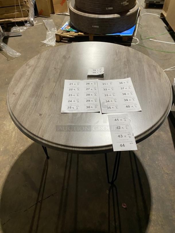 Brand new Werzalit 41.33" round tabletop in Ponderosa Grey, model 064776, with matte steel hairpin legs.