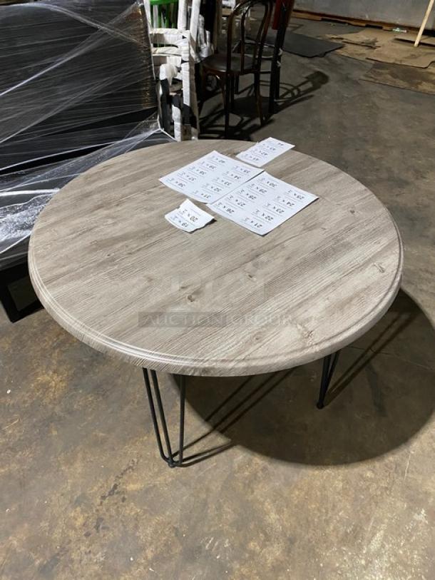 Brand new Werzalit 41.33" round tabletop in Ponderosa Grey, model 064776, with matte steel hairpin legs.