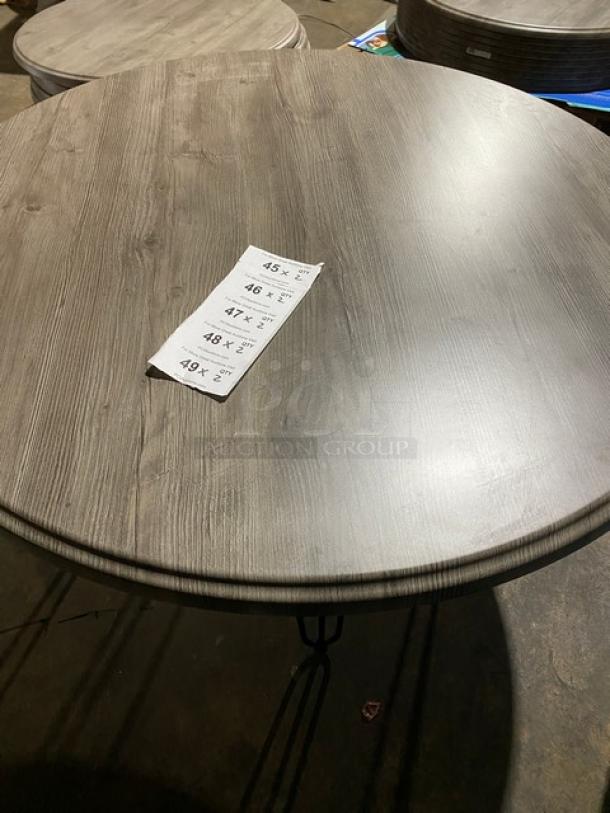 Brand new Werzalit round tabletop, model 064411, in Ponderosa Grey with matte steel hairpin legs, 47.24 inches.