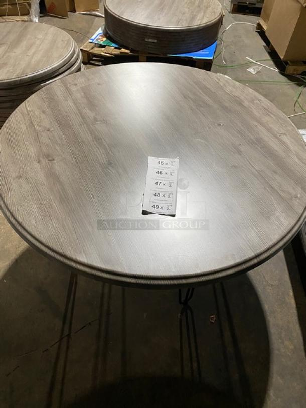 Werzalit 47.24" round Ponderosa grey tabletop, model 064411, with matte steel hairpin legs, brand new condition.