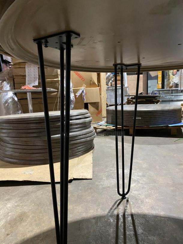 Brand new Werzalit 47.24" round tabletop in Ponderosa Grey with matte steel hairpin legs, Model 064411.