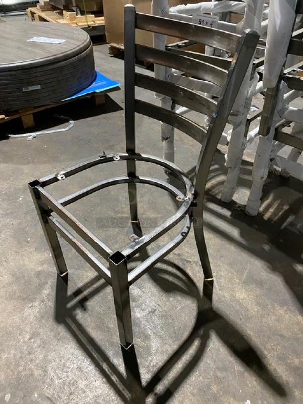 Brand new commercial metal ladder-back style stackable dining chair frame with a durable finish.