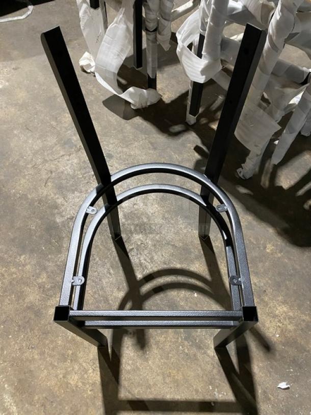 Brand new commercial black steel stackable dining chair frame with curved backrest. Pristine condition, durable construction.