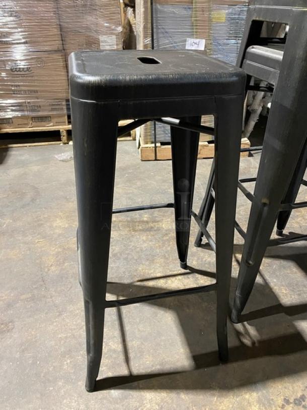 Brand new black metal backless industrial-style stackable bar stool with a square seat, commercial-grade, tag reads "3X Your Bid".