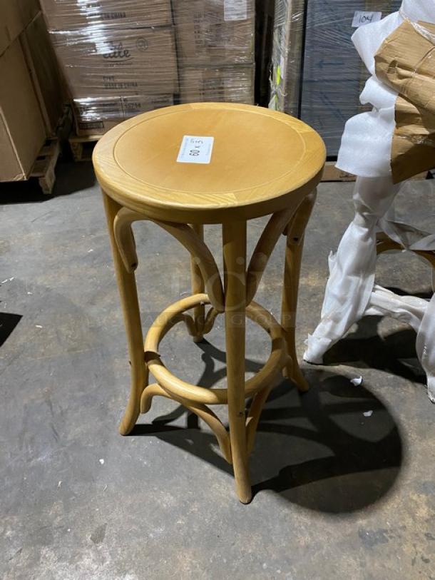 Brand new natural finish backless bentwood bar stool, commercial grade, sturdy design, smooth round seat, label visible.