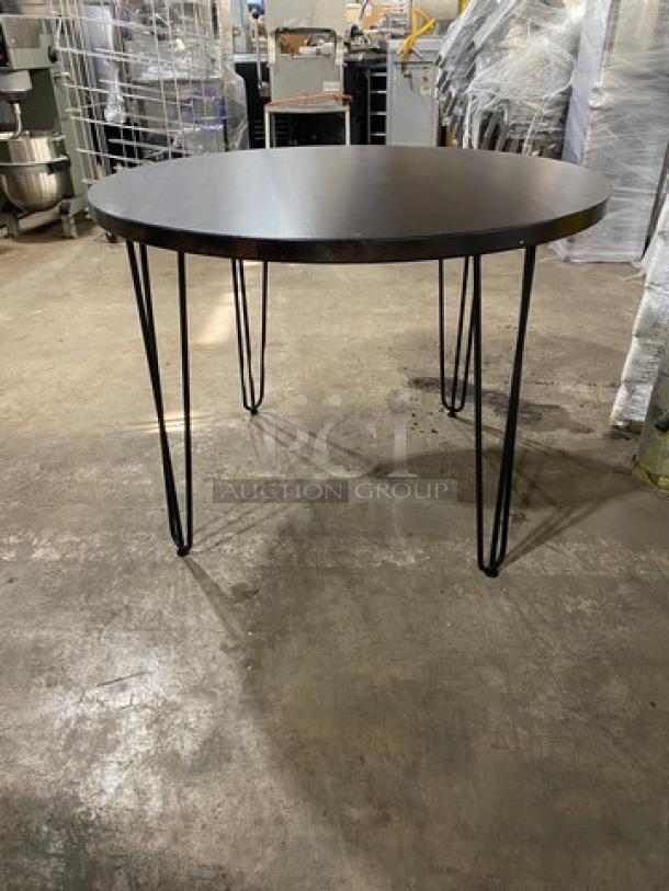 New commercial red oak 42" round walnut-finished butcher block style bar-height dining table with hairpin legs.